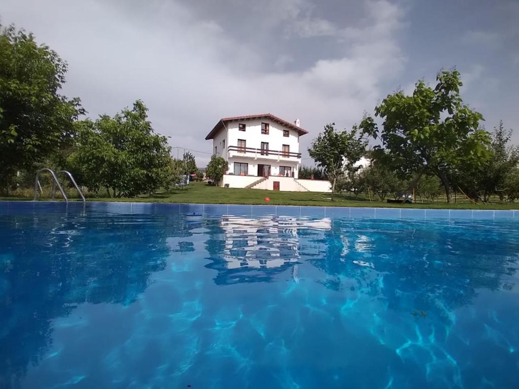 a house with a swimming pool in front of it at Villa SALAM in Ifrane