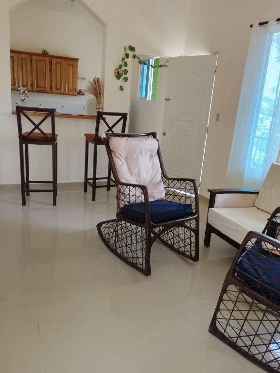 a living room with two chairs and a couch at Katty House in Santa Bárbara de Samaná