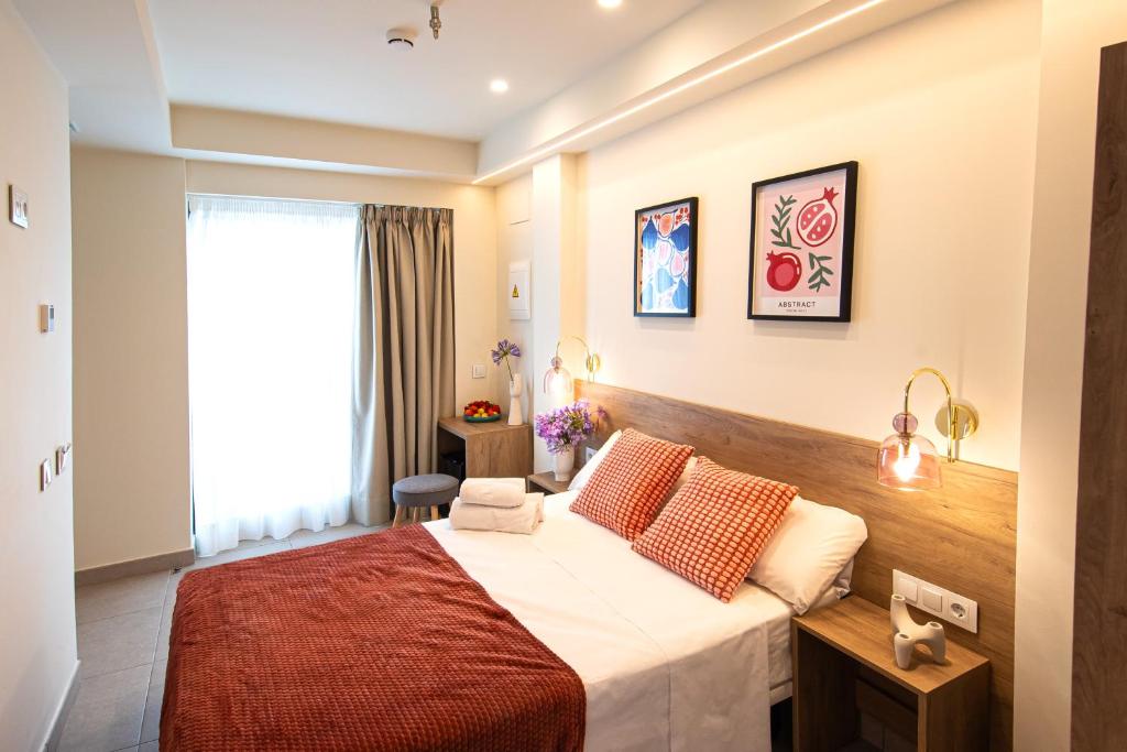 a hotel room with a bed and a window at Luz House Marbella Hostal in Marbella