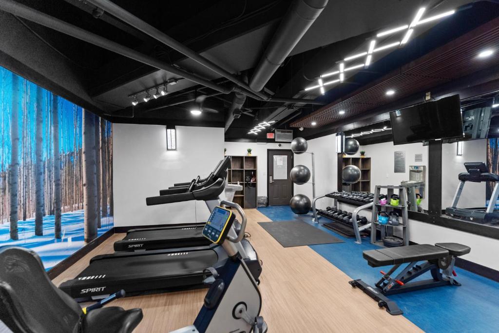 a gym with treadmills and exercise equipment in a room at Silver Mill #8274 in Keystone