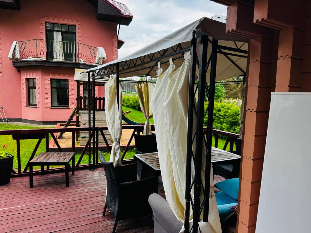 a gazebo on the deck of a house at River Kemping in Jūrmala