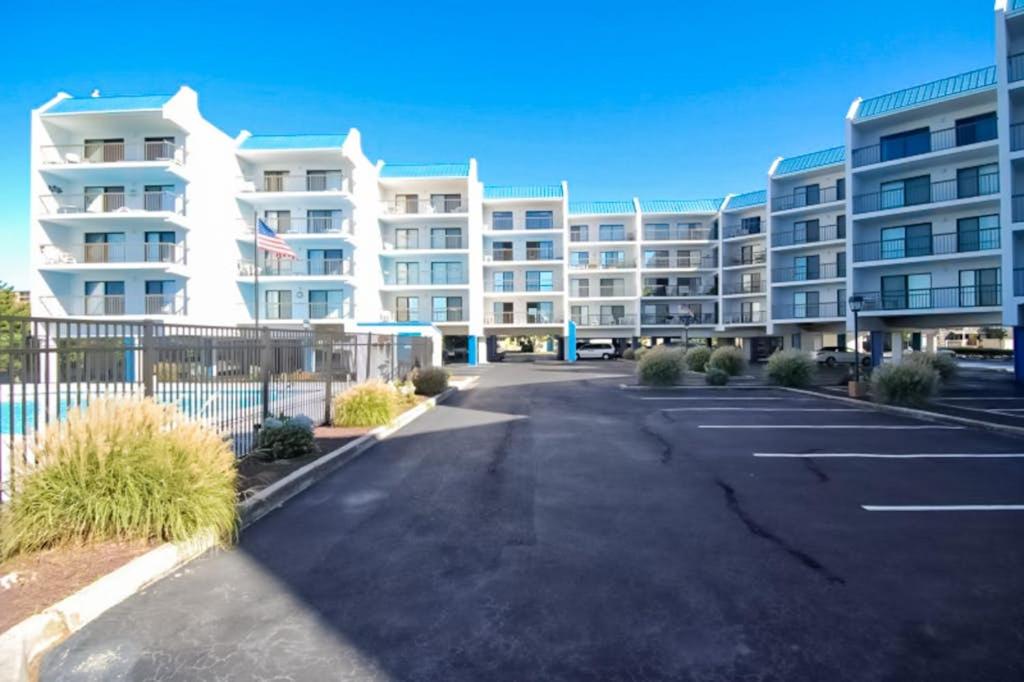 a parking lot in front of a large apartment building at Bay Princess 103 in Ocean City