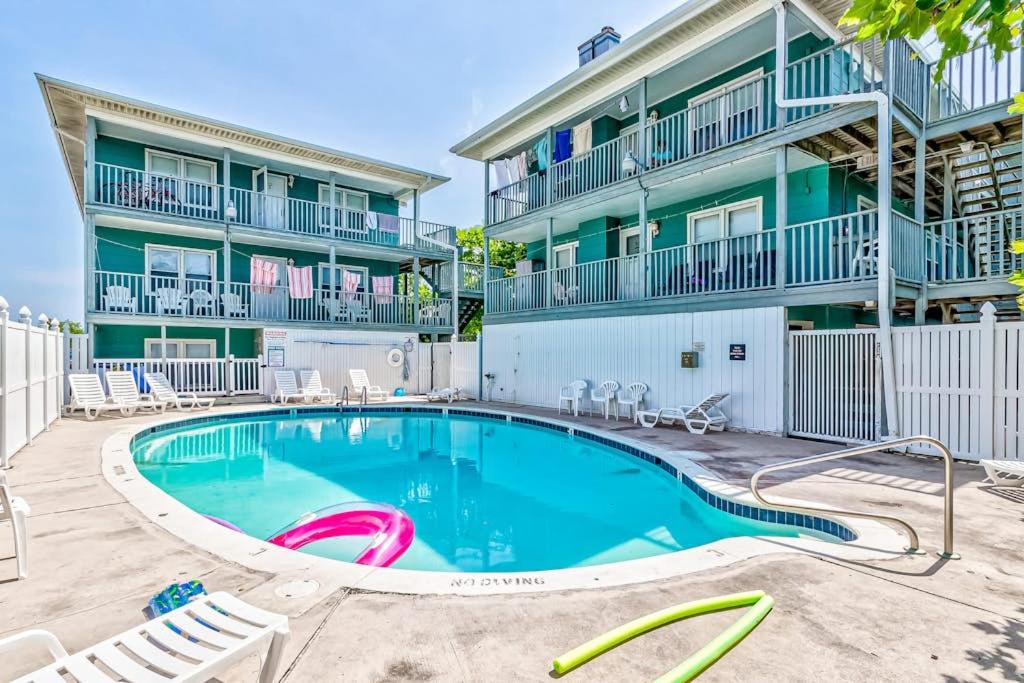 a swimming pool in front of a building at Sea Nymph in Ocean City