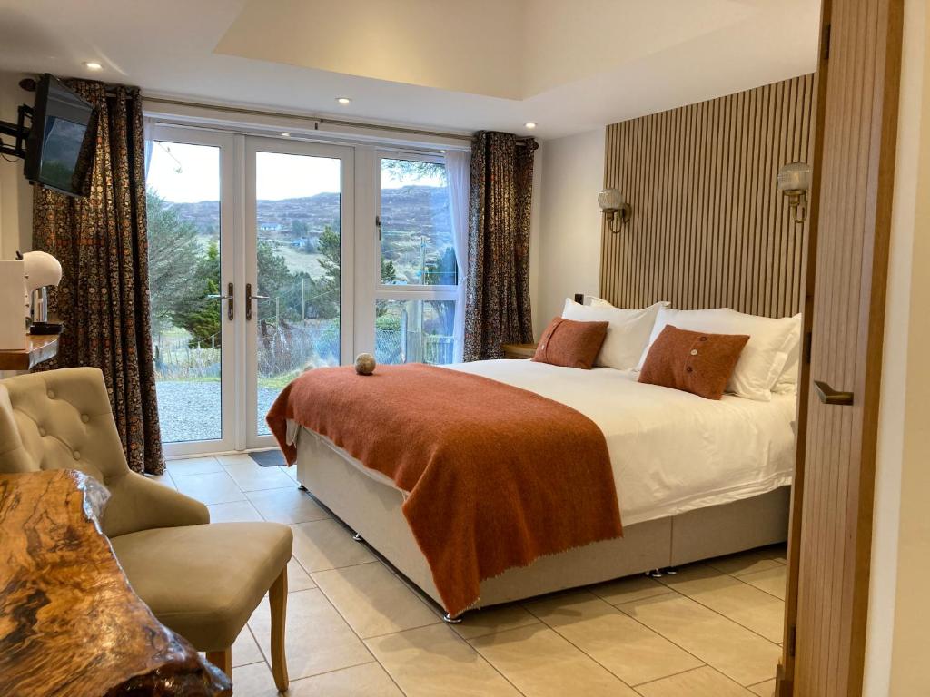 a bedroom with a bed and a large window at Glendale View in Glendale