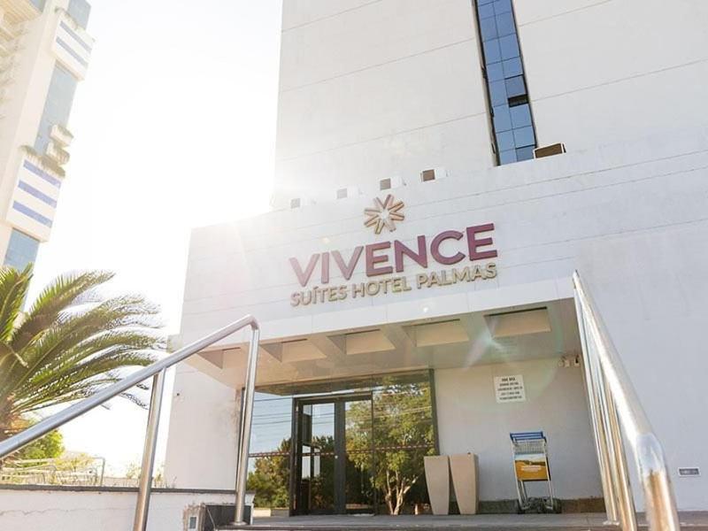 a sign on the side of a building at AliReserva Luxury Suites in Palmas