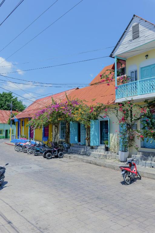 a group of motorcycles parked in front of a building at Casa Ramona in Flores