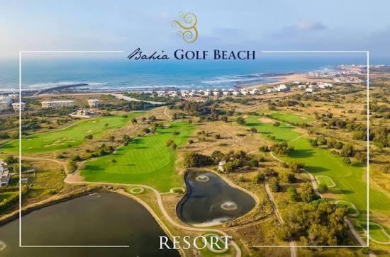 an aerial view of the golf course at the beach at Superbe Appartement Bord de mer in Bouznika