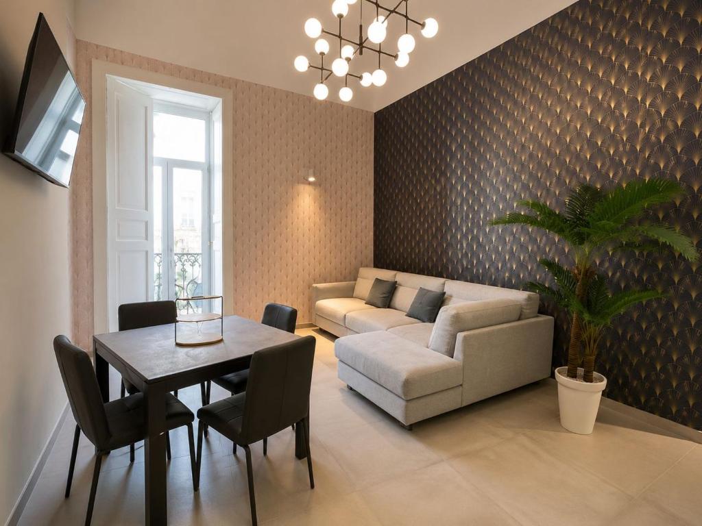 a living room with a couch and a table at Donna Sofia in Torre Annunziata