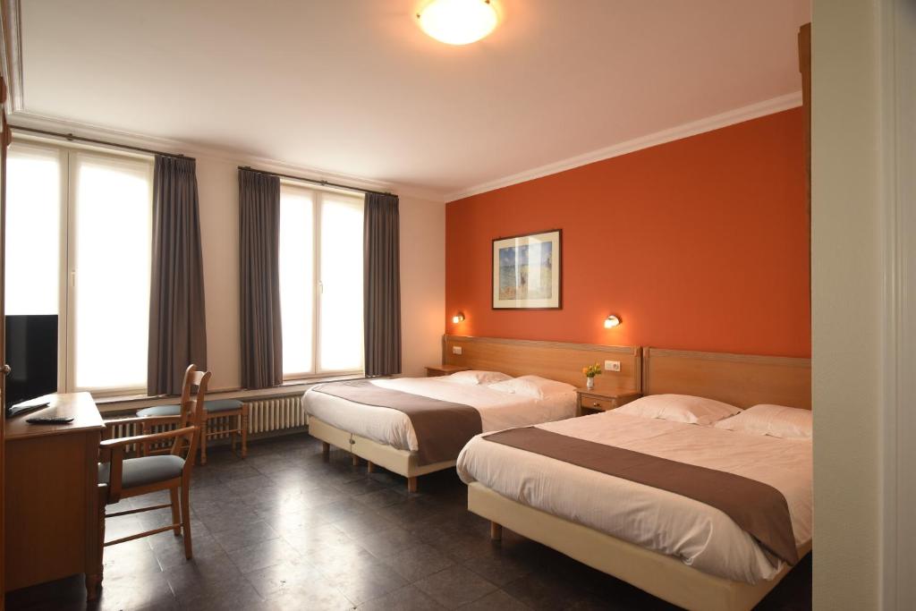 Postel nebo postele na pokoji v ubytování Hotel Sabot D'Or