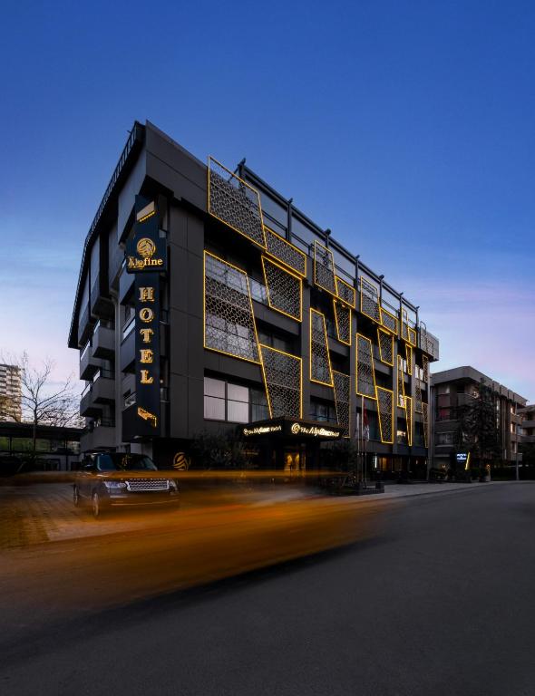 a building with a car in front of it at The Alpfine Hotel in Ankara