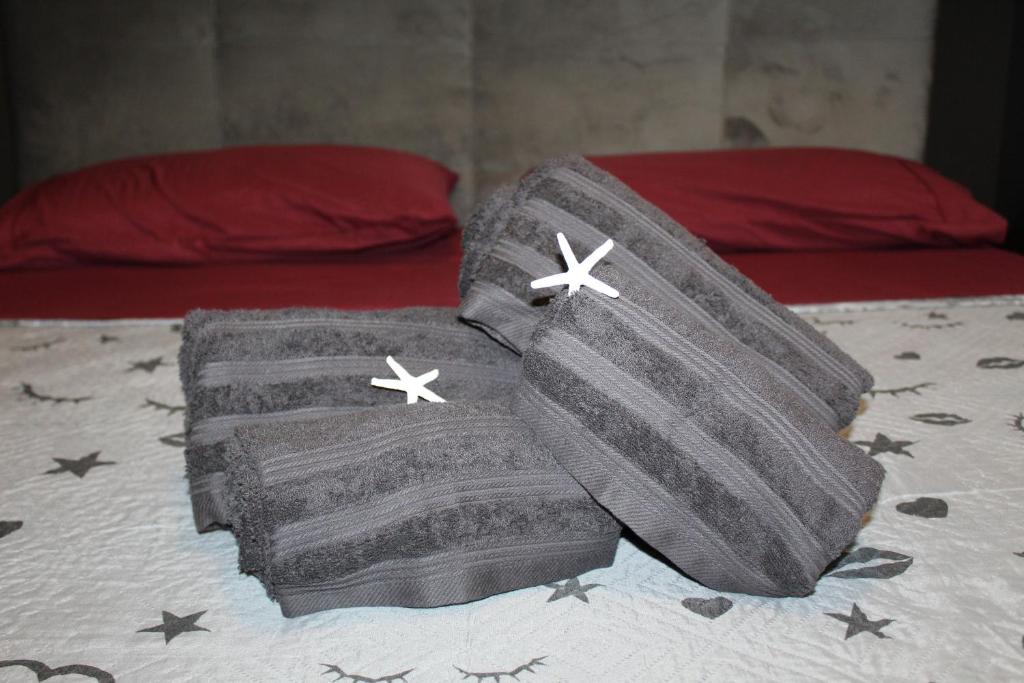 a pair of towels sitting on top of a bed at Loft vista mare in Silvi Marina