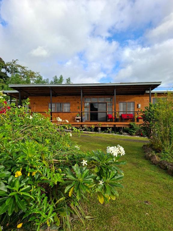 a house with a garden in front of it at Luna Studio in Apia