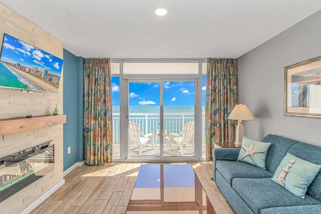 a living room with a couch and a view of the ocean at Atlantica 1055 in Myrtle Beach
