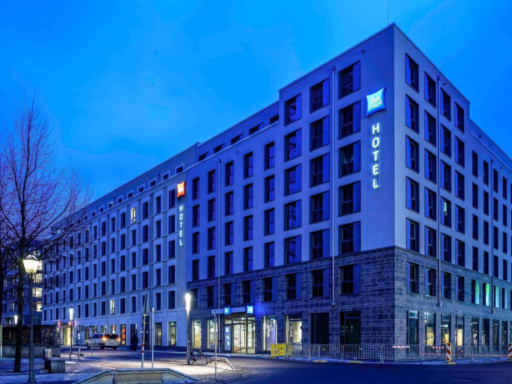 a large building with a sign on the side of it at Ibis Budget Leipzig City in Leipzig