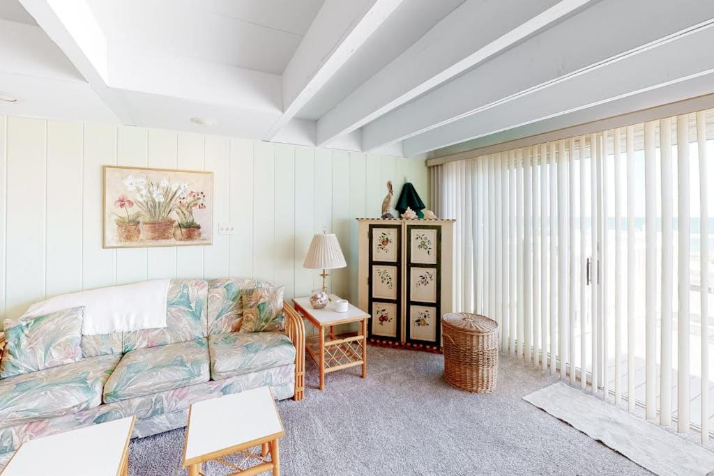 a living room with a couch and a table at White Sands Village 30 in Ocean City