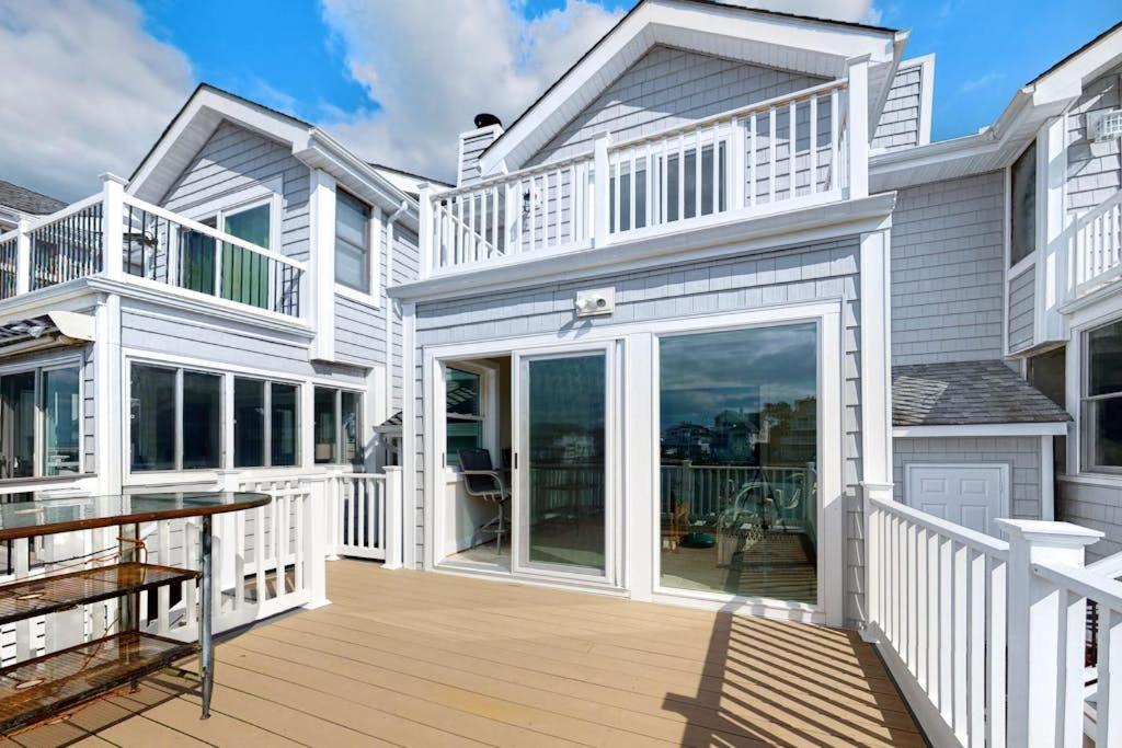 a large white house with a large deck at Sunset Harbour B in Ocean City