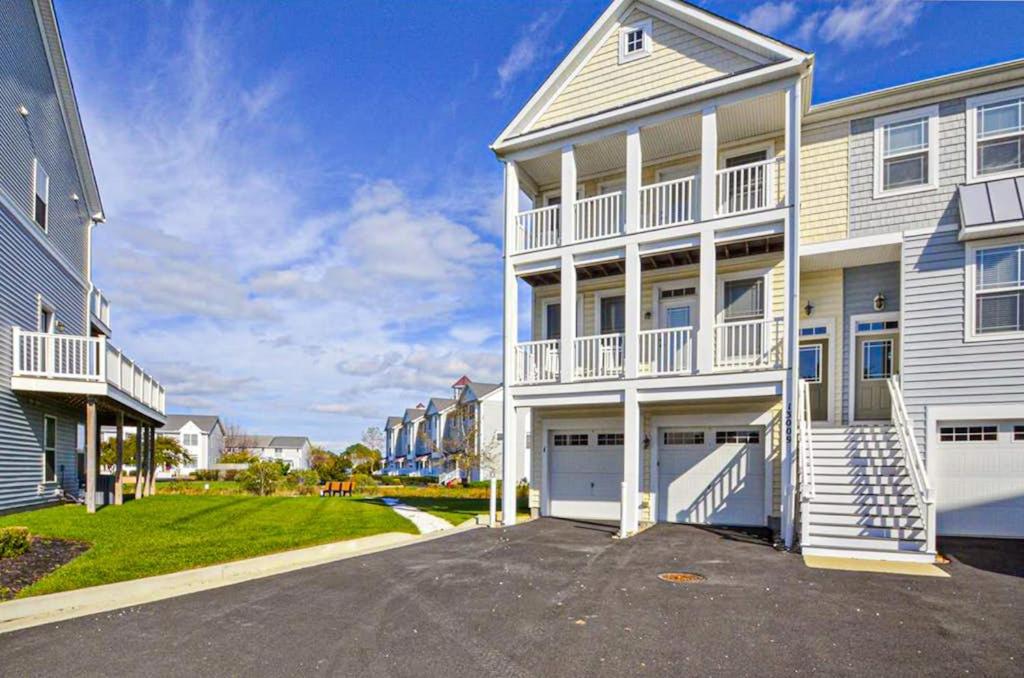 a white house with a driveway in front of it at 13009 Bowline Ln 1 in Ocean City