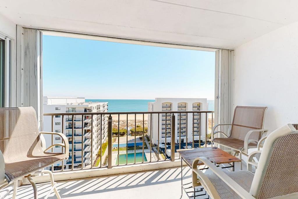 a balcony with chairs and a view of the ocean at Excalibur 905 in Ocean City