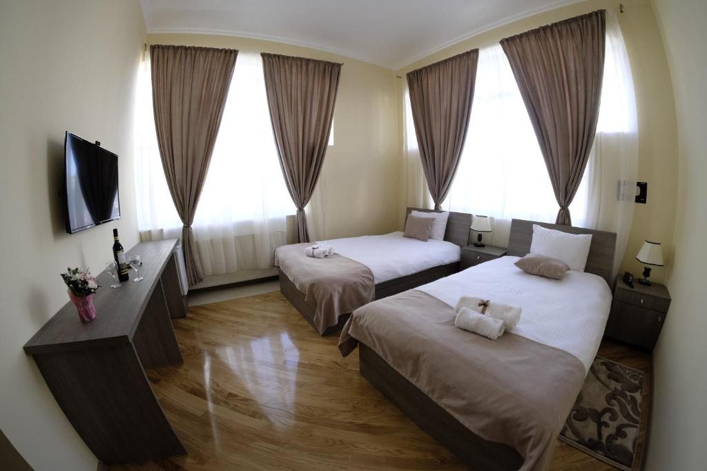 Postel nebo postele na pokoji v ubytování S&L Boutique Hotel
