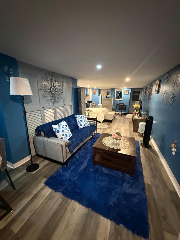 a living room with a couch and a table at Maxis-place in Jersey City