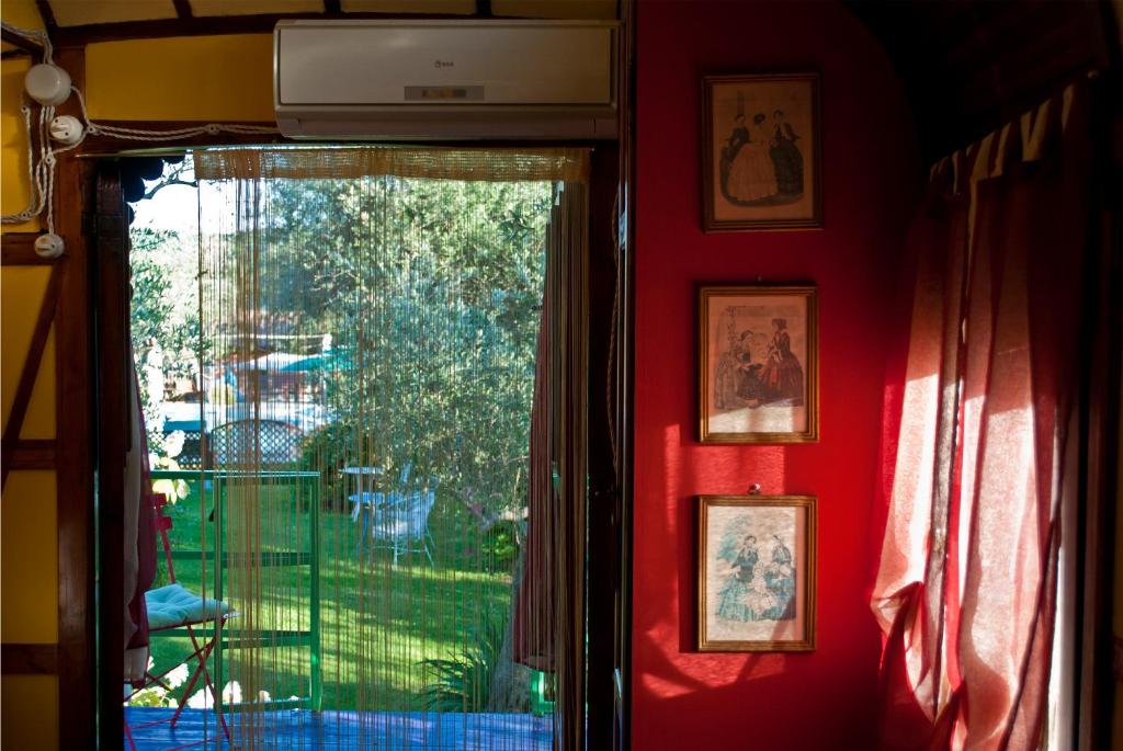 a window in a room with a view of a yard at Azienda agricola Della Mezzaluna in Stiava