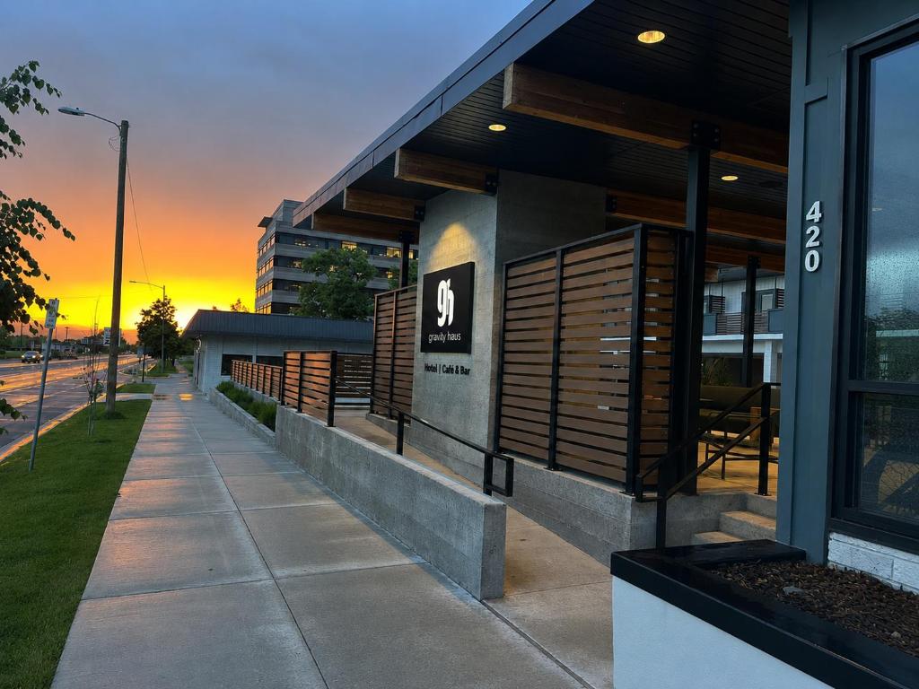 a building with a sunset in the background at Gravity Haus Missoula in Missoula