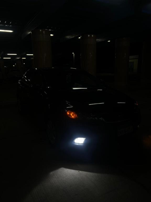 a car parked in a parking lot at night at Mohamed Hamada in Aswan