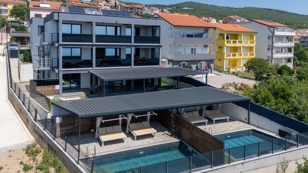 an aerial view of a building with a swimming pool at Villa Twins in Crikvenica
