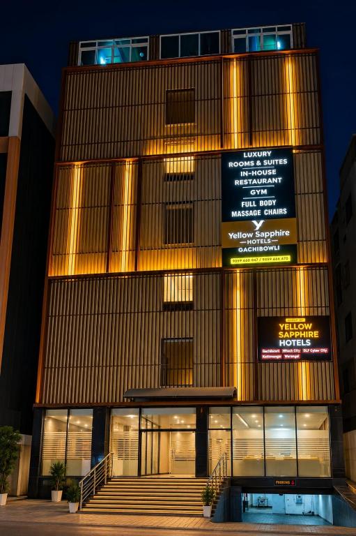 a building with lights on the side of it at Yellow Sapphire Hotel Gachibowli in Hyderabad