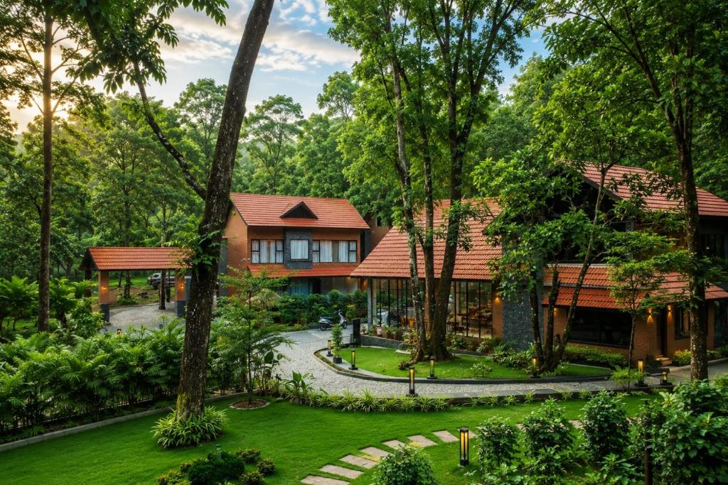 an aerial view of a house in the forest at Athirapilly Fernvalley Resort in Athirappilly