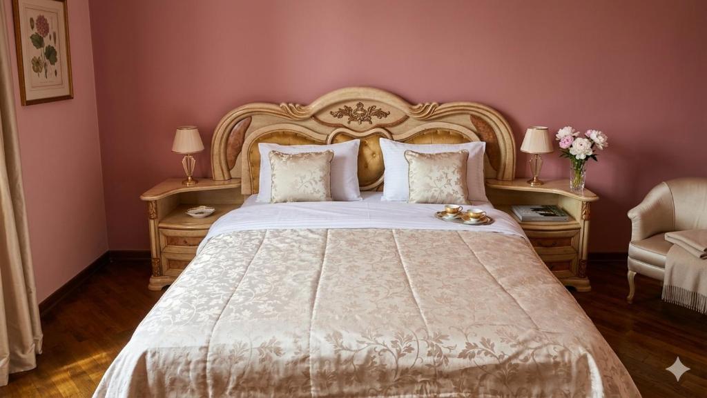 a bedroom with a large bed with pink walls at Elkasa guest house in Zvartnots International Airport