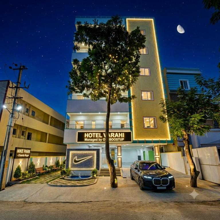 a car parked in front of a hotel at night at Hotel JK Height's Miyapur, Near Lingampally Railway Station in Lingampalli