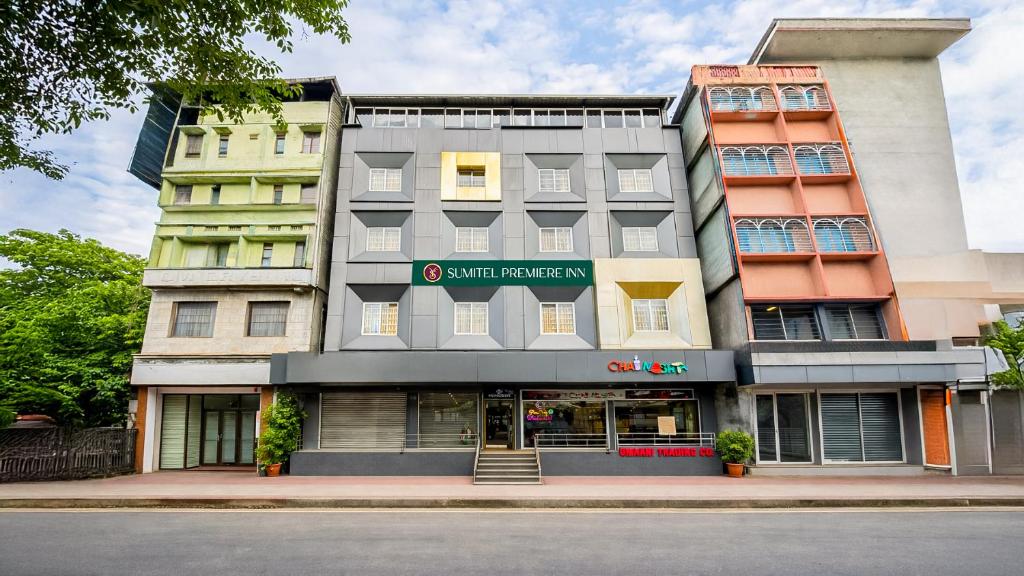 a building on the corner of a street at Sumitel Premier Inn in Siliguri
