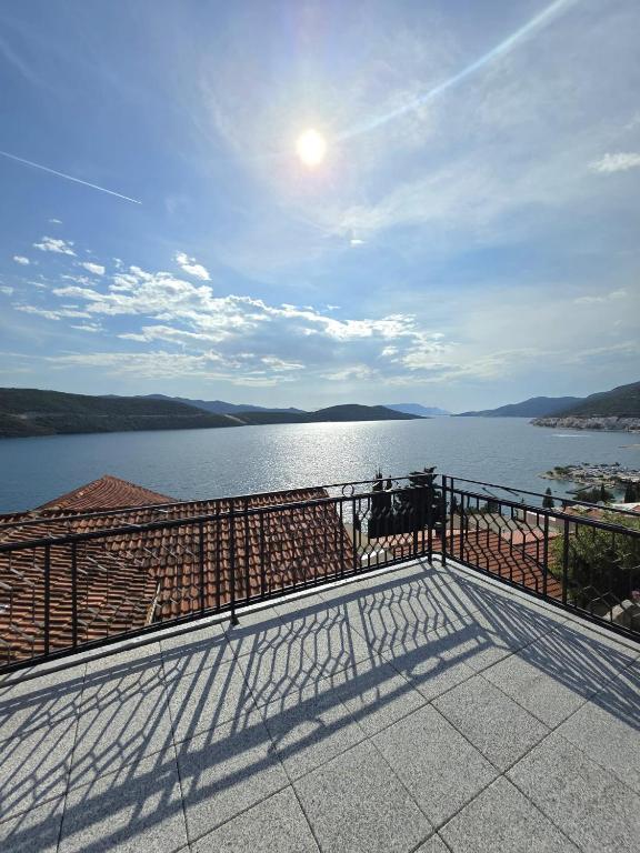 a balcony with a view of a body of water at Guest House Lara in Neum