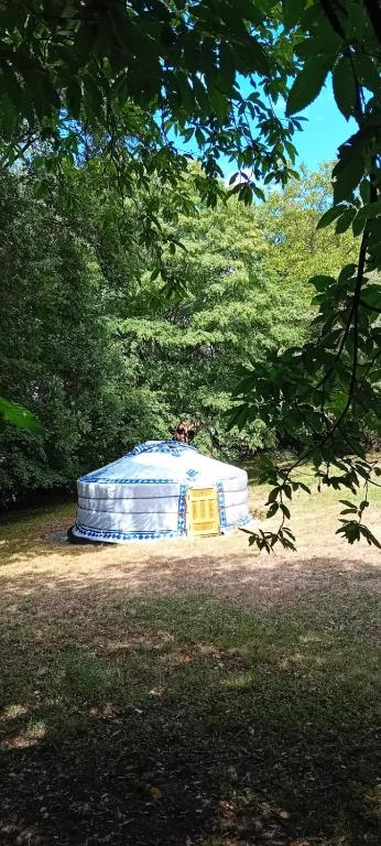 a large igloo in the middle of a field at La yourte gasconne in Estampures