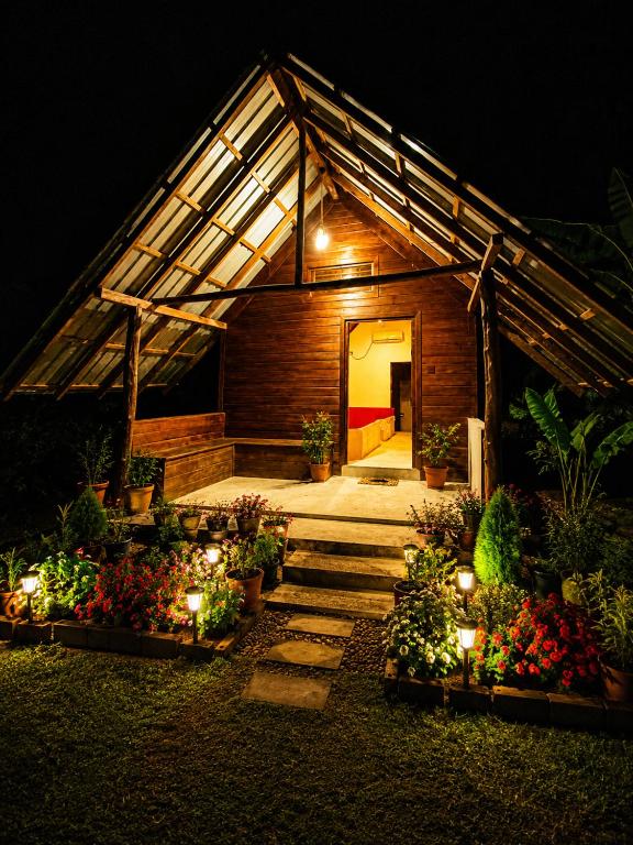 a greenhouse with a bunch of flowers and lights at Nature Lounge in Udawalawe