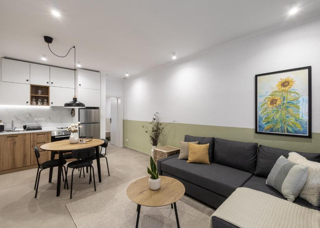 a living room with a couch and a table at Garden House Retreat-Suite in Drama