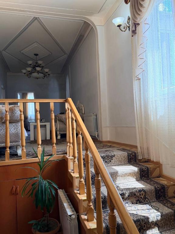 a staircase in a house with a plant at holiday house in Gavarr