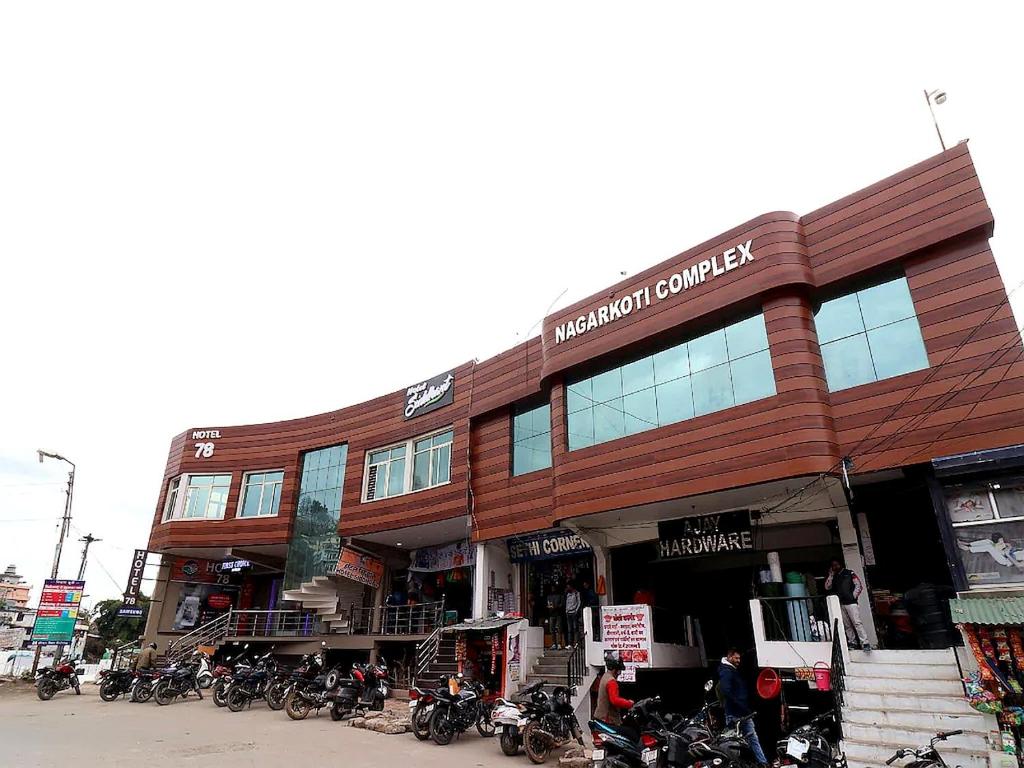 a building with motorcycles parked in front of it at Hotel Siddhant in Pithorāgarh