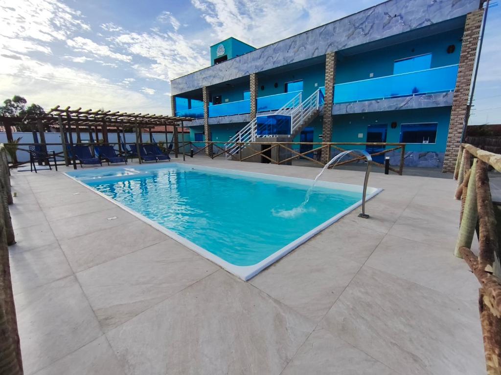 a swimming pool on the roof of a building at Pousada Imperio Azul in Santo Amaro