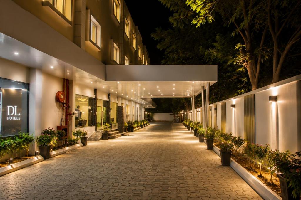 a hallway of a building at night with lights at Hotel Indraprasttha in Vijayawāda