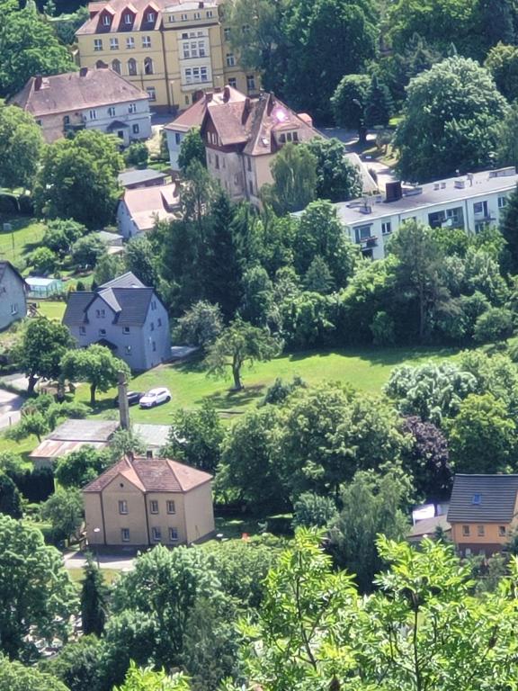 a small town on a hill with houses and trees at Bobrowe Zacisze in Wleń