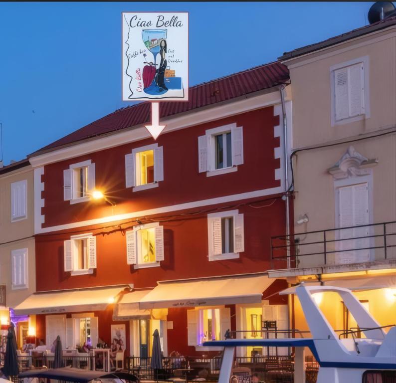 a building with a sign in front of it at B&B Ciao Bella in Veli Lošinj