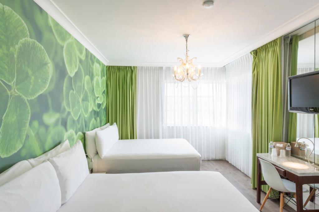 Postel nebo postele na pokoji v ubytování President Hotel