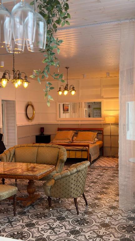 a living room with a couch and a table at Venezia in Haapsalu
