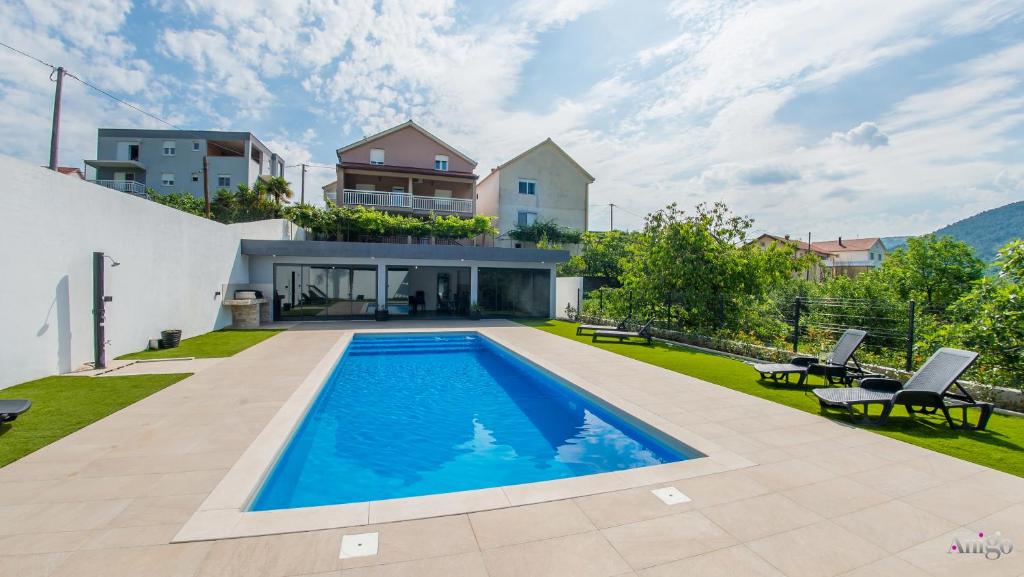 a swimming pool in the backyard of a house at Villa Amor in Mostar