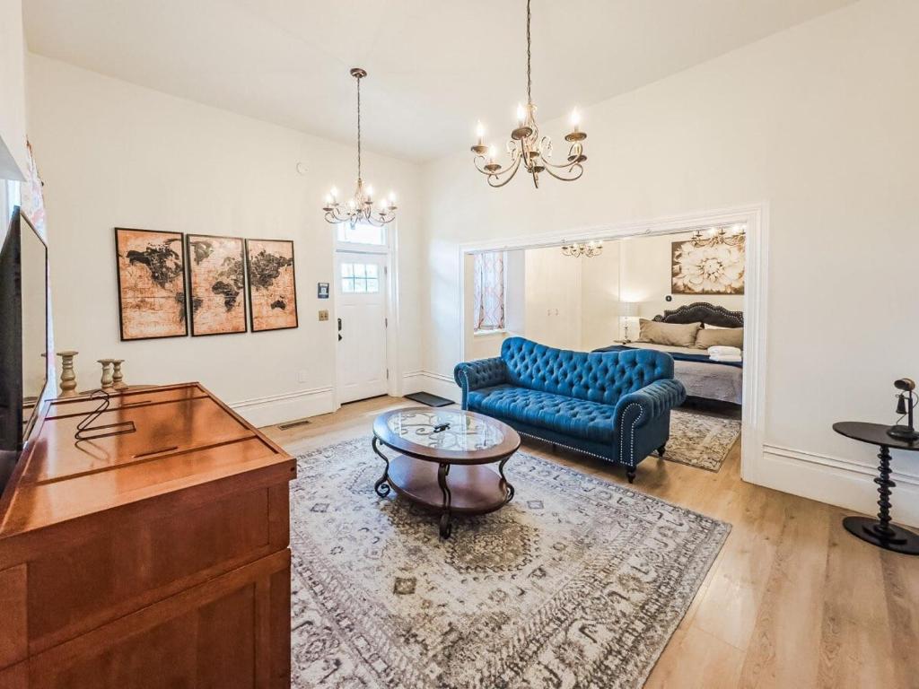 a living room with a blue couch and a table at 406 Canyon Rd #2 in Ogden