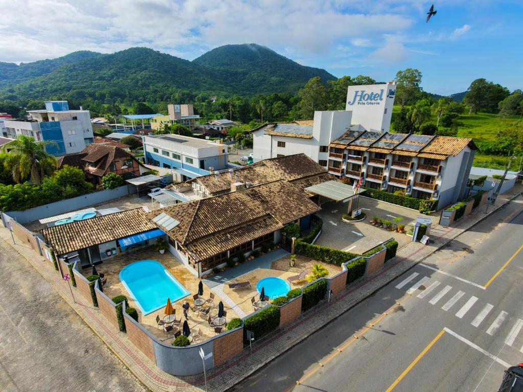 an aerial view of a resort with mountains in the background at Vila Olaria Hotel in Penha