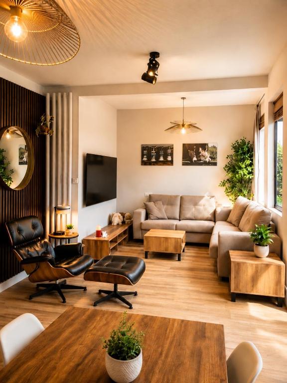 a living room with a couch and a table at CaL QuEROL Select One in Puigcerdà