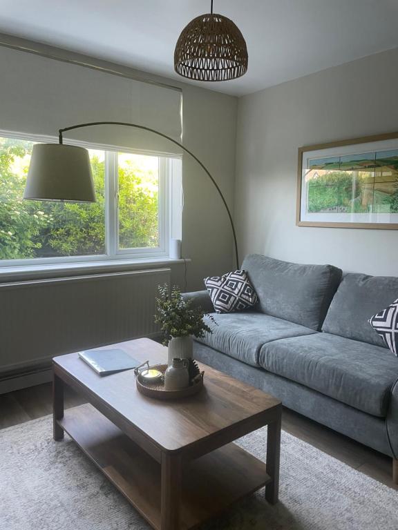 a living room with a couch and a coffee table at High Tide in Whitstable